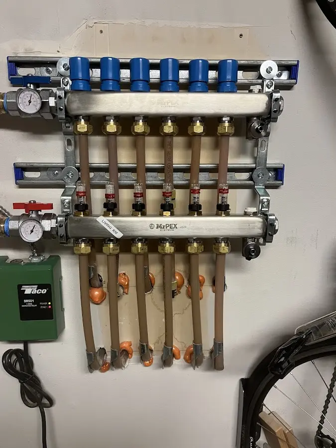 Plumber performing Water Heater Repair at a residential property in Castle Pines Village